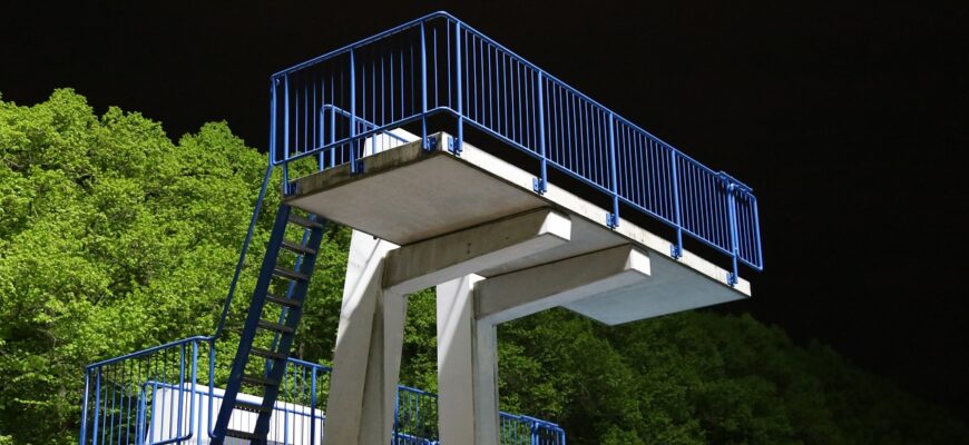 outdoor pool, diving platform, night