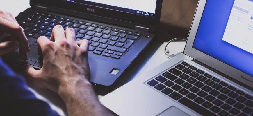 person using black laptop computer