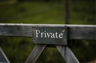 gray wooden welcome to the beach signage